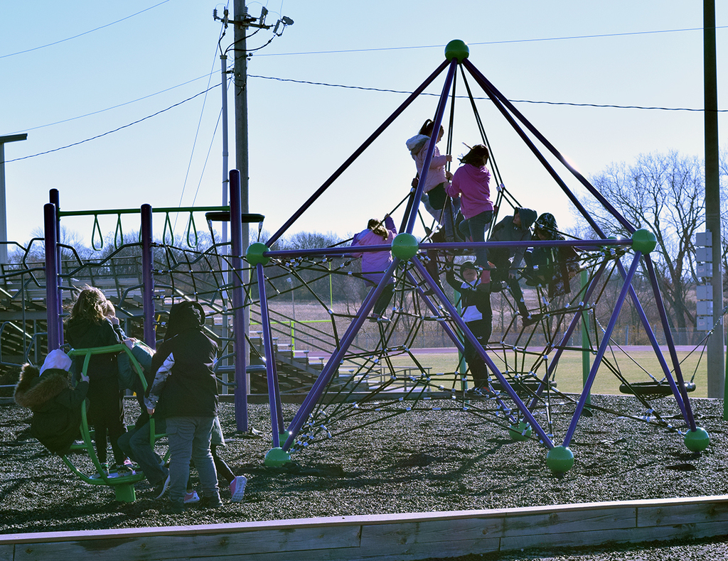 students on playground equipment